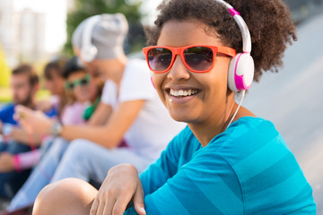 Smiling young woman with headphones