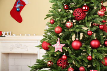 Decorated Christmas tree in room closeup