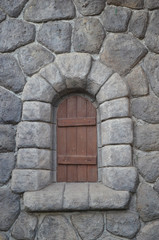 small fake window in stone wall