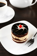 Yummy chocolate cupcake on table, close-up