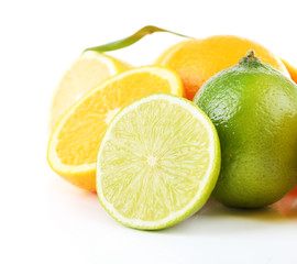 Fresh juicy limes and oranges isolated on white
