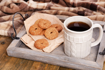 Cup of tea with cookies on table close-up
