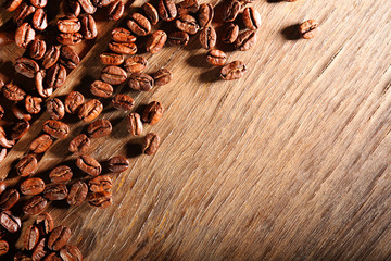Coffee beans on wooden background