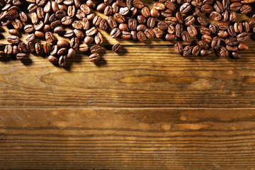 Coffee beans on wooden background