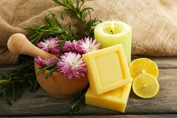Handmade soap with the branches of rosemary, fresh flowers and