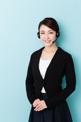 portrait of asian operator on blue background