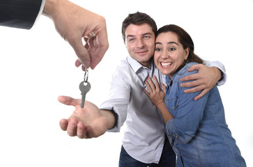 happy couple receiving new house key real state concept