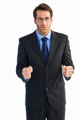 Angry businessman with closed fists looking at camera