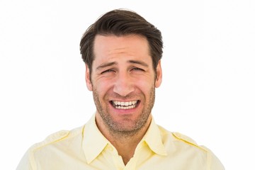 Desperate handsome man frowning at camera