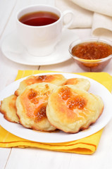 Cheese pancakes, confiture and tea cup