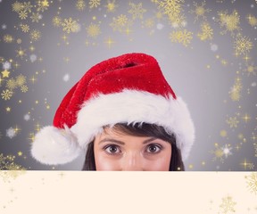 Close up portrait of pretty woman in santa hat