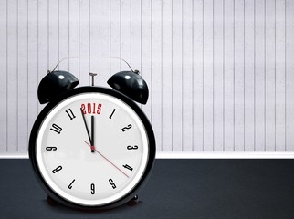 Composite image of 2015 in black alarm clock