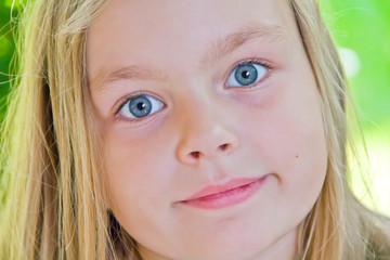 Cute girl with big blue eyes
