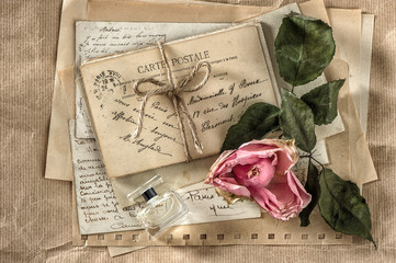 old love letters, perfume and dried rose flower. scrapbook paper