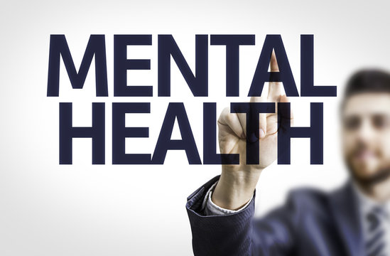 Business man pointing the text: Mental Health