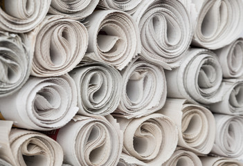Rolls of newspapers.