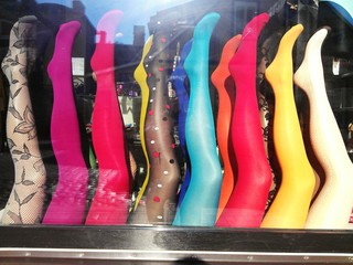 Mannequins' legs worn in stockings showcased in storefront