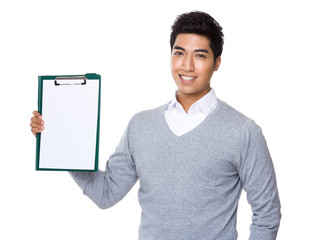 Businessman with blank clipboard