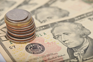 coins on dollar notes