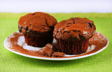 Yummy chocolate cupcake on table