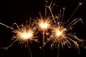 Three burning christmas sparklers