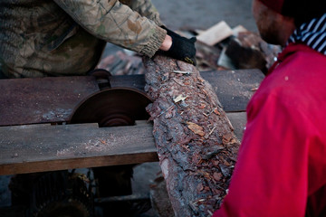 carpenter  works on woodworking the machine tool
