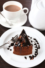 Yummy chocolate cake served on table, close-up