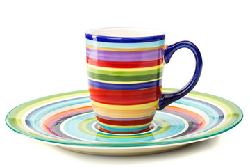 set of colored plates and cups isolated background