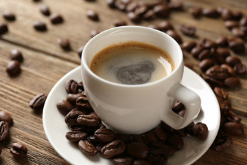 Cup of coffee on wooden table