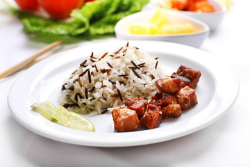 Tasty rice with meat served on table, close-up