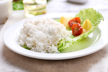 Boiled rice served on table, close-up