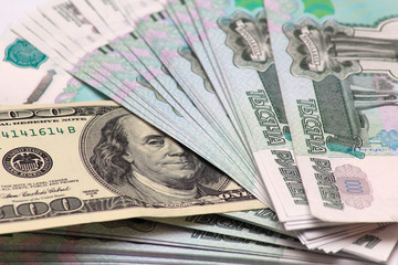Hundred dollars and Russian to one thousand rouble banknotes