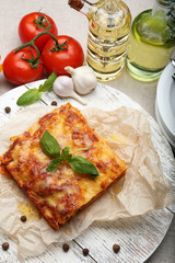 Portion of tasty lasagna on table