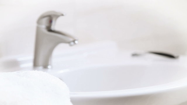 Young female Hand washing with dolly-in and dolly-out technique