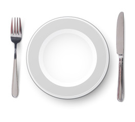 Empty plate with knife and fork on a white