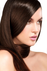 Fototapeta premium Beauty model showing perfect skin and long healthy brown hair