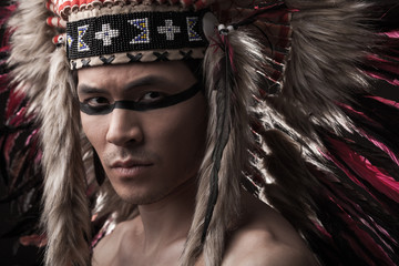 Indian strong man with traditional native american make up