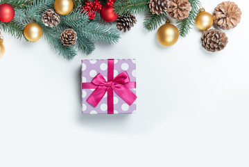 Fototapeta na wymiar Christmas gift with pine branch on white background.