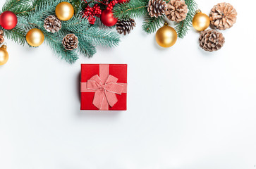 Christmas gift with pine branch on white background.
