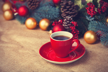 Cup of coffee and christmas gifts.