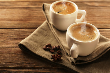 Two cups of coffee on wooden table