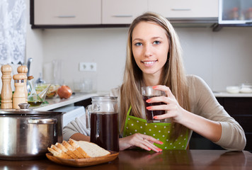  woman  with brown beverage