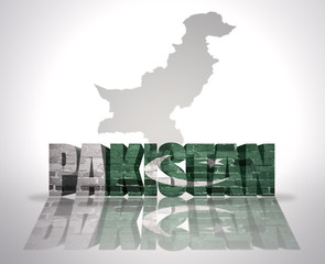 Word Pakistan on a map background