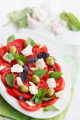 salad with tomato goat cheese and olives