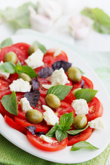 Italian salad with tomato goat cheese