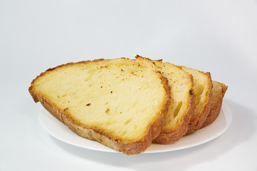 Golden freshly baked bread sliced into thin pieces