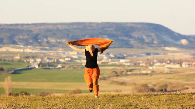 blonde girl on the windy hill