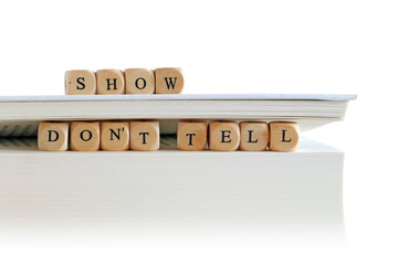 book with message "show don't tell" for story writers