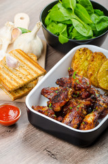 Sticky chicken wings with garlic panini bread