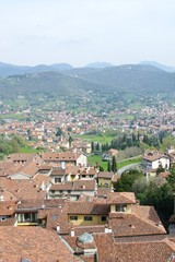 Fototapeta na wymiar Red roofs of buildings in Bergamo in Italy